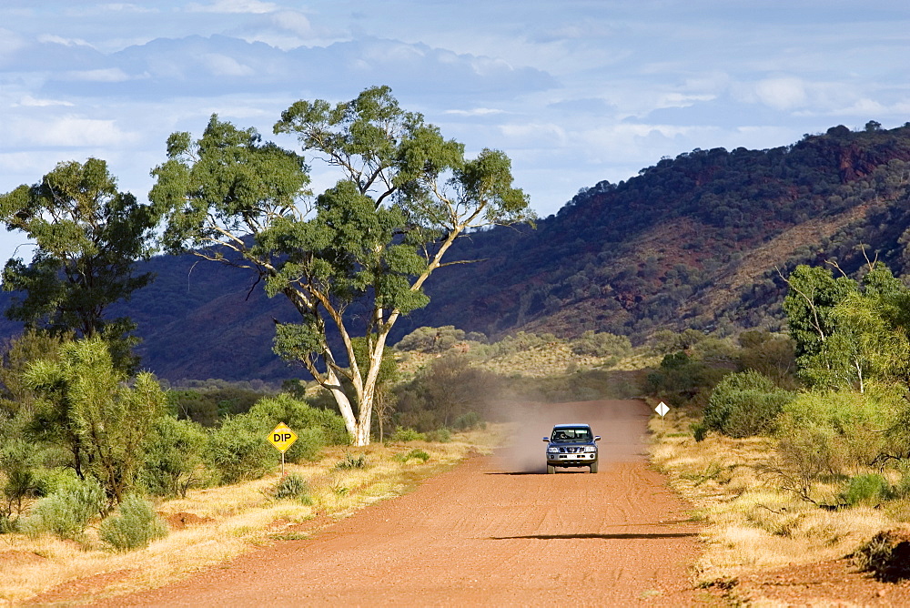 Four-wheel-drive vehicle on the Mereenie Loop Road, Red Centre, Australia