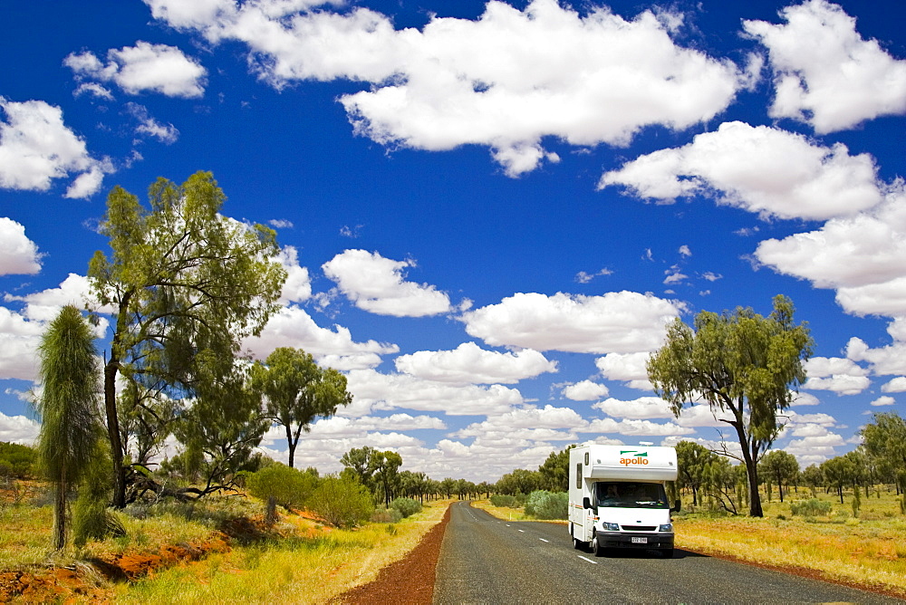 Motorhome travels road in the Red Centre, Northern Territory, Australia