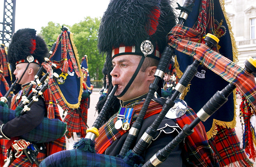 Scots Guards playing the bagpipes in London parade, UK