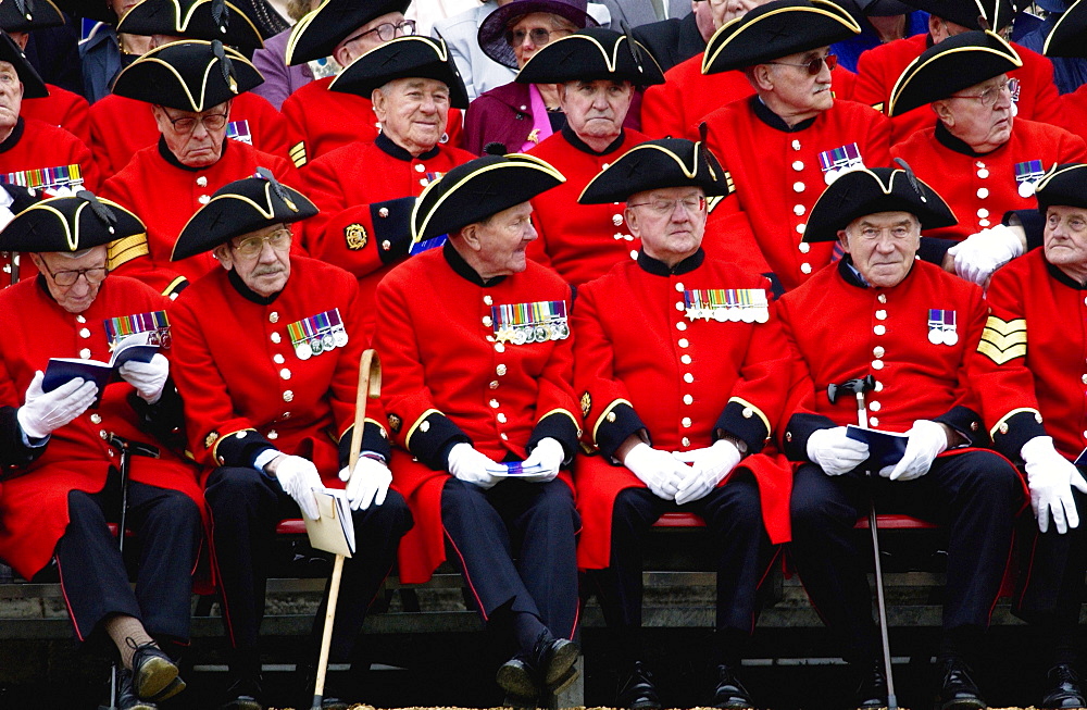 Chelsea Pensioners - the Corps of war veterans cared for at the Royal Hospital in Chelsea and known for their distinctive red uniforms and tricorn hats. They proudly display their medals won for valour.