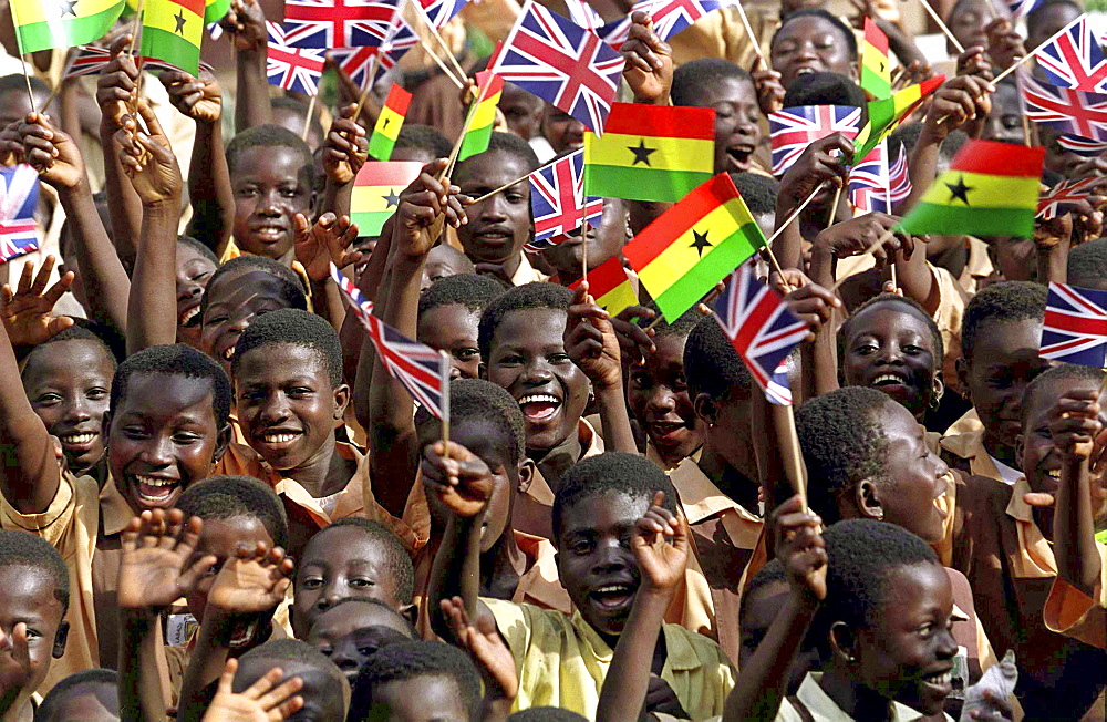 Children in Accra waving British and Ghana flags