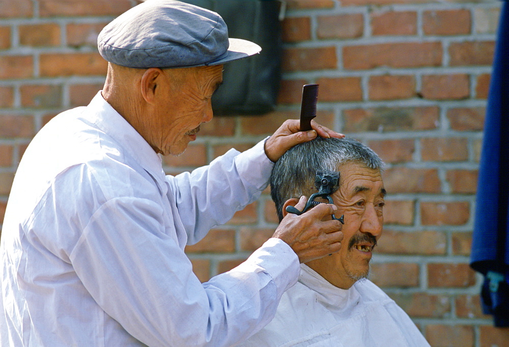 Barber at workoutdoors in Beijing, China