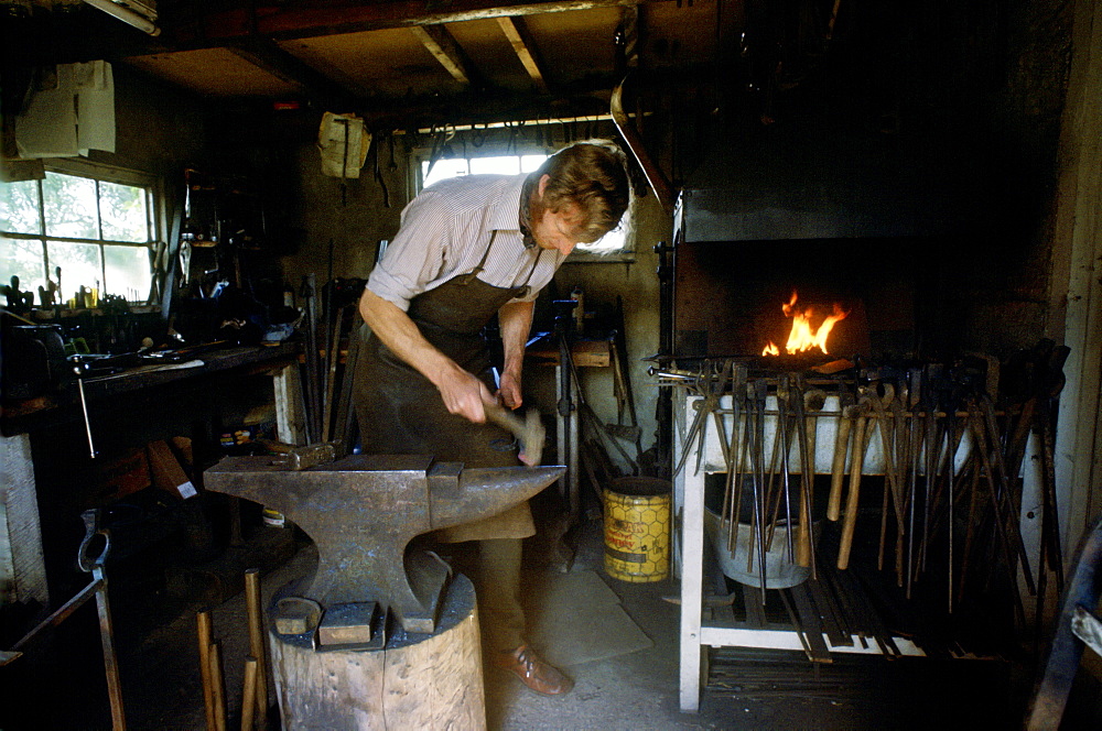 Blacksmith Hector Cole working on new gates for Highgrove the country residence of the Prince of Wales, which have been paid for by money donated by the people of Tetbury as a wedding gift for the royal couple, 1981