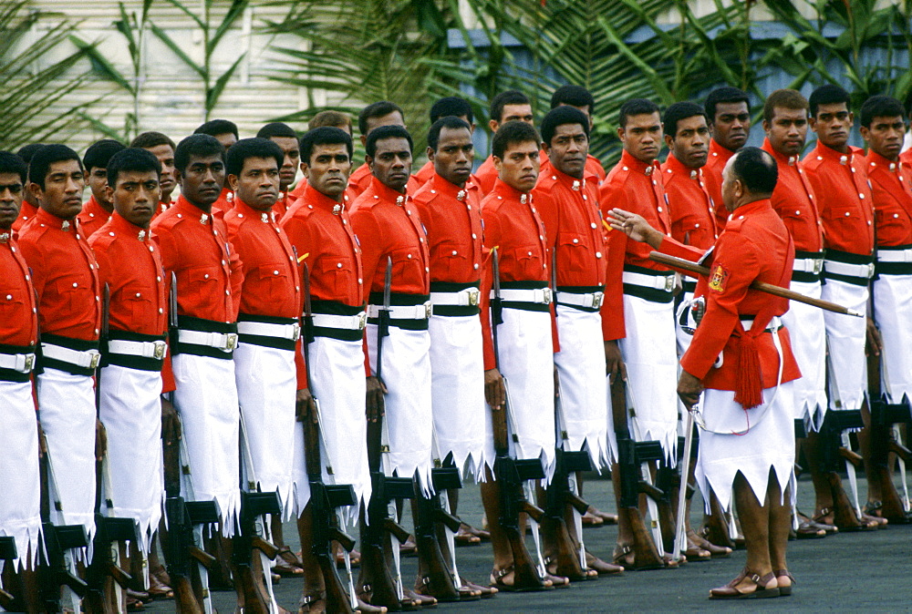 Fijian soldiers standing to attention during a ceremonial parade.