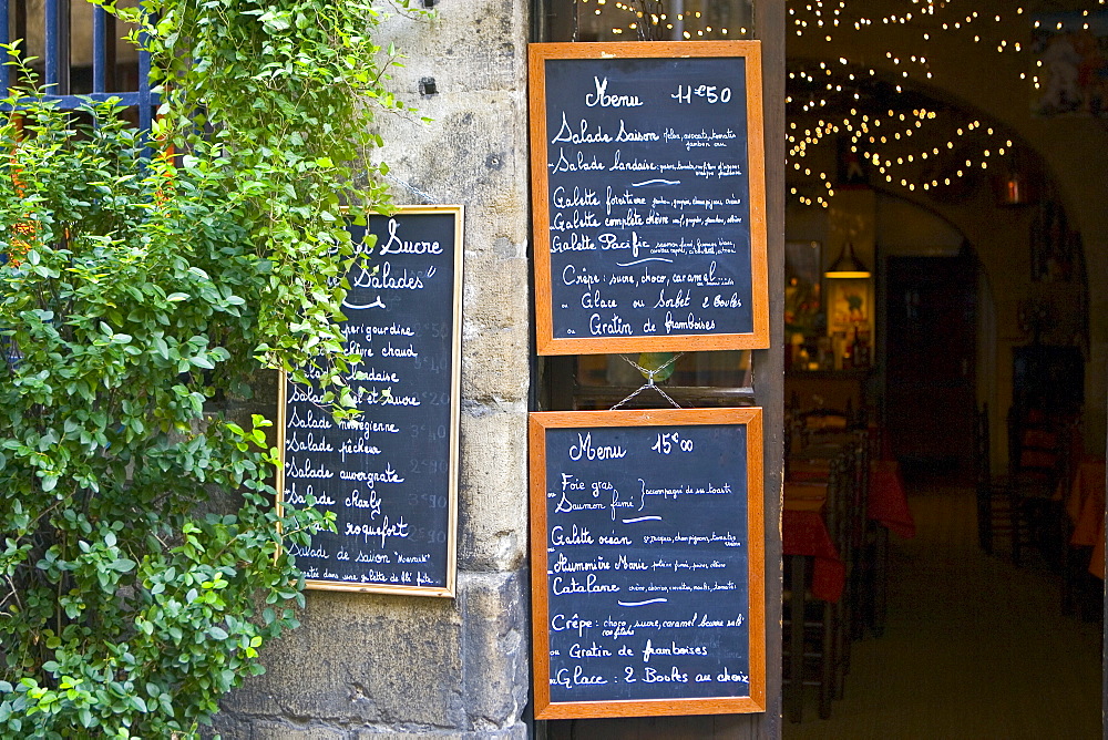 French menus outside cafe restaurant in Bordeaux, France.