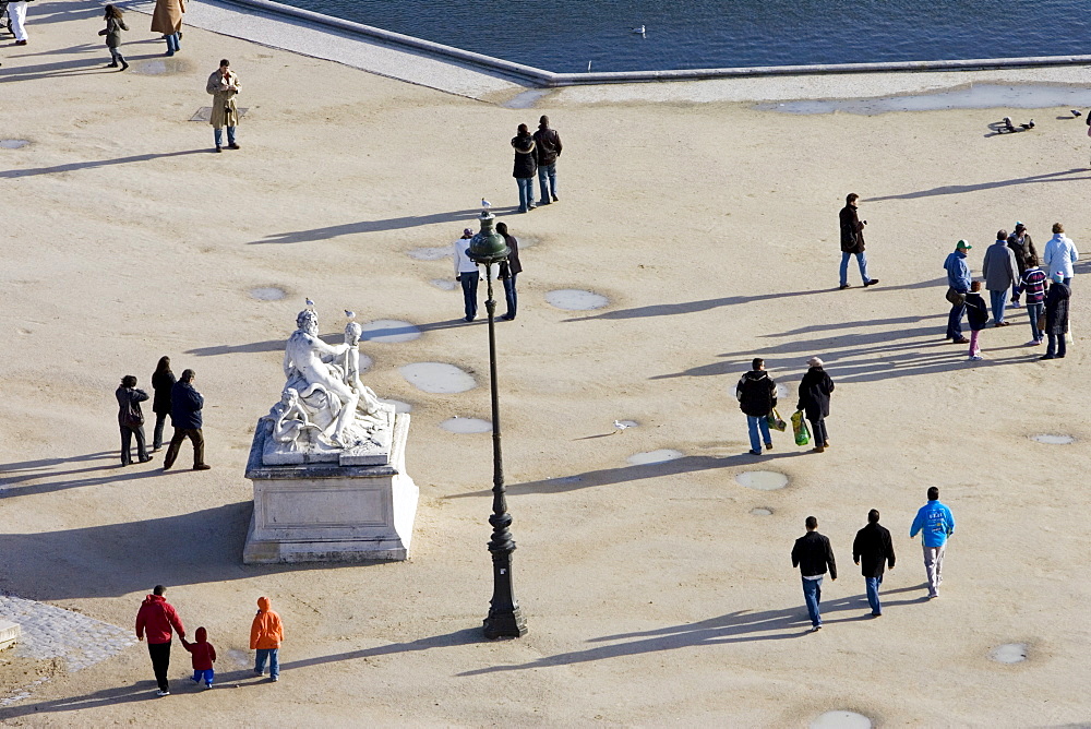 Visitors stroll through Jardin des Tuileries, Central Paris, France