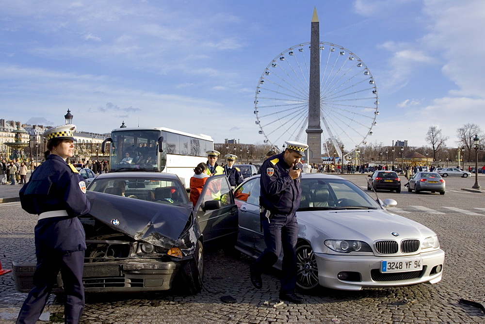 Traffic police investigate car accident between two BMW cars in Place de la Concorde, Central Paris, France