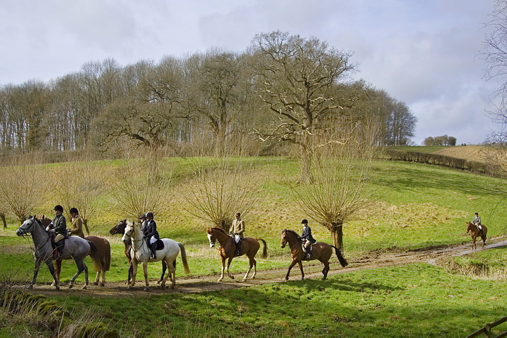 Members of Heythrop Hunt ride across Oxfordshire countryside, United Kingdom