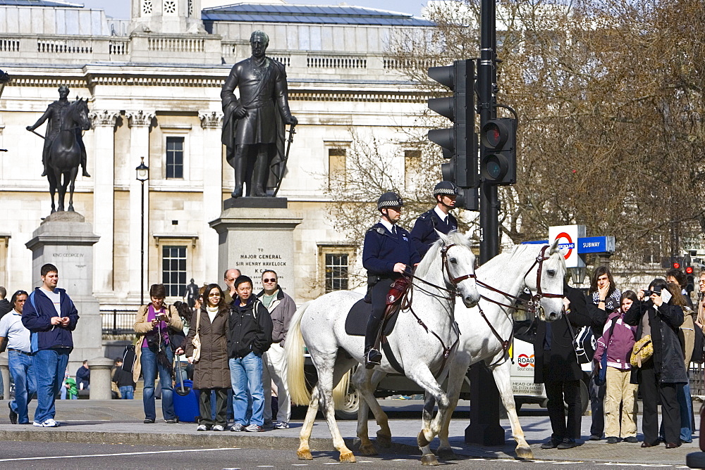 Community police officers on horseback in Trafalgar Square, London, England, United Kingdom