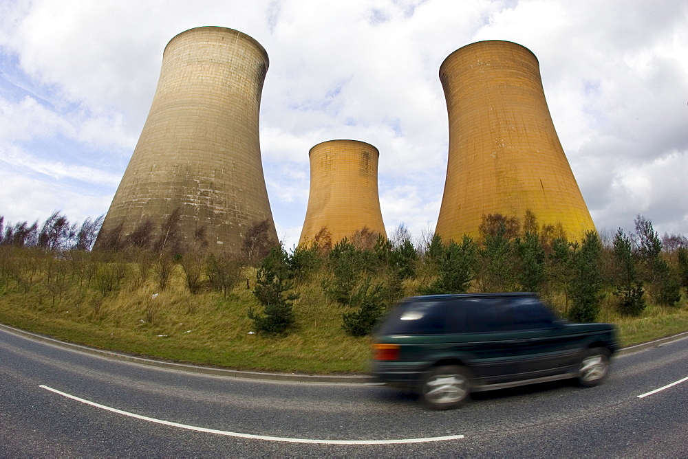 Four wheel drive vehicle passes Rugeley Power Station, Staffordshire, United Kingdom