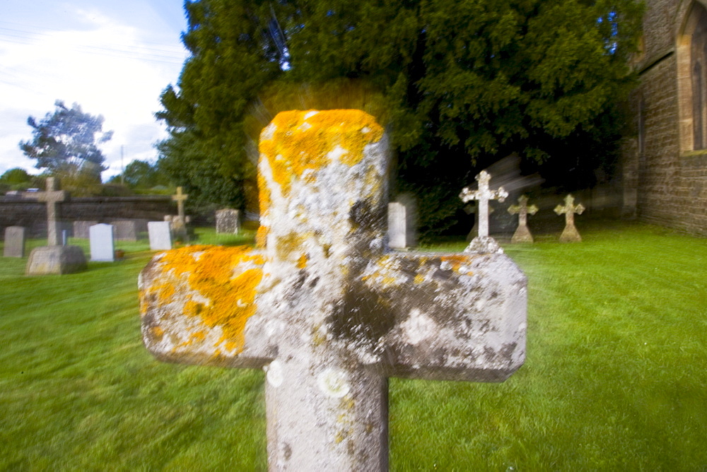 Gravestones in churchyard at All Saints Church in Church Lench, Worcestershire, UK