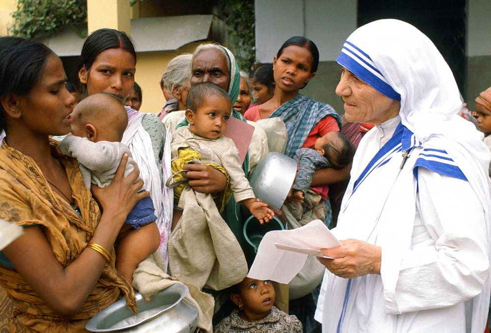 Mother Teresa with mothers and children at her Mission in Calcutta, India