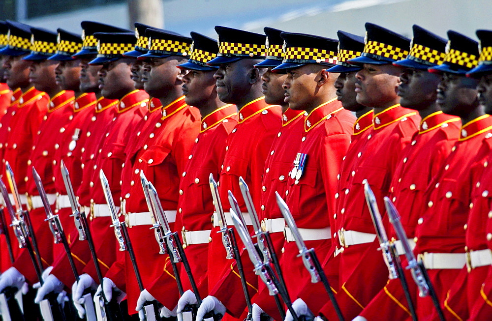 A Guard of Honour, dressed in bright red jackets at Parliament in Kingston, Jamaica