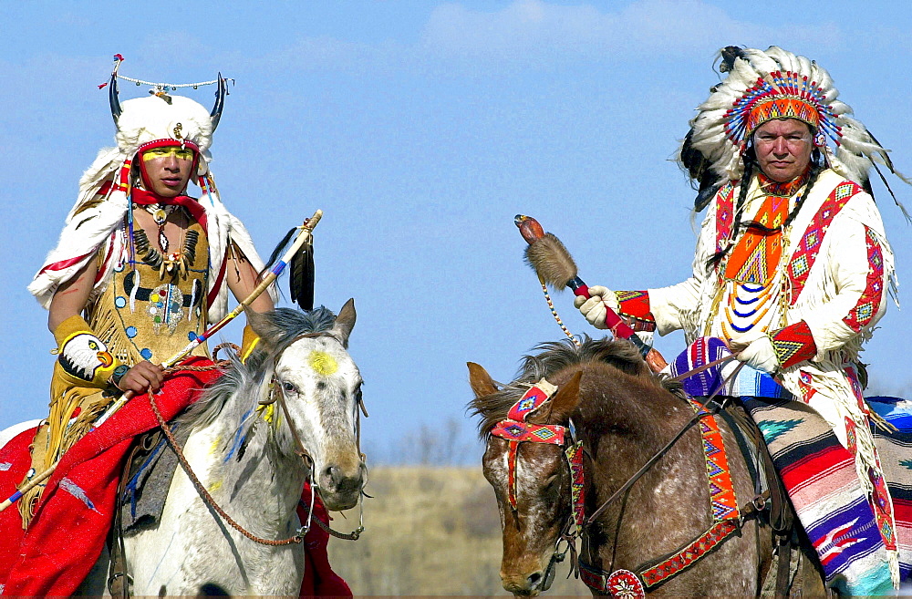 Canadian Plains Indians chiefs on horseback at cultural display at Wanuskewin Heritage Park in Saskatoon, Canada