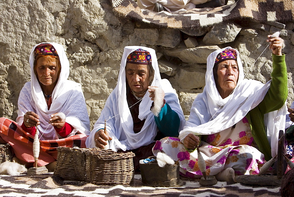 Women spin wool together in mountain village of Altit in Hunza region of Karokoram Mountains, Pakistan