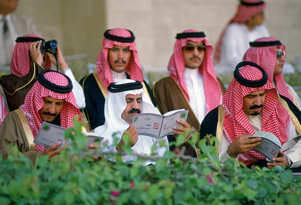 Men watching horse racing at Riyadh Races, Saudi Arabia.