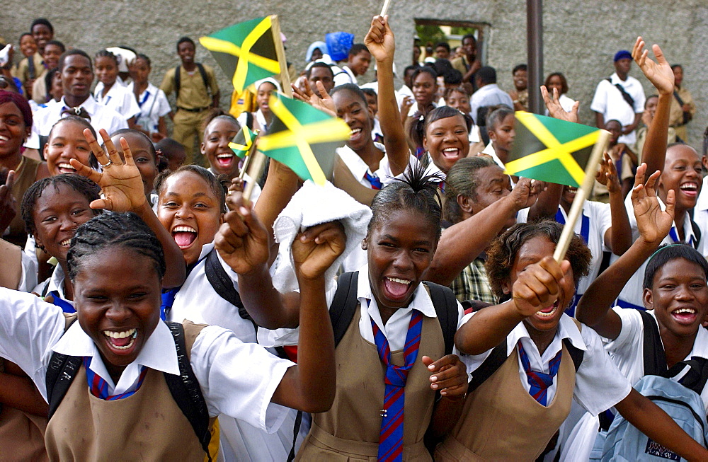 Schoolgirls waving flags and cheering