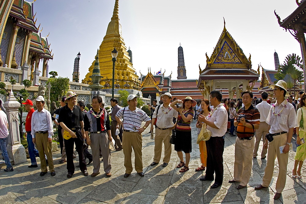 Tourists visit the Grand Palace Complex in Bangkok, Thailand