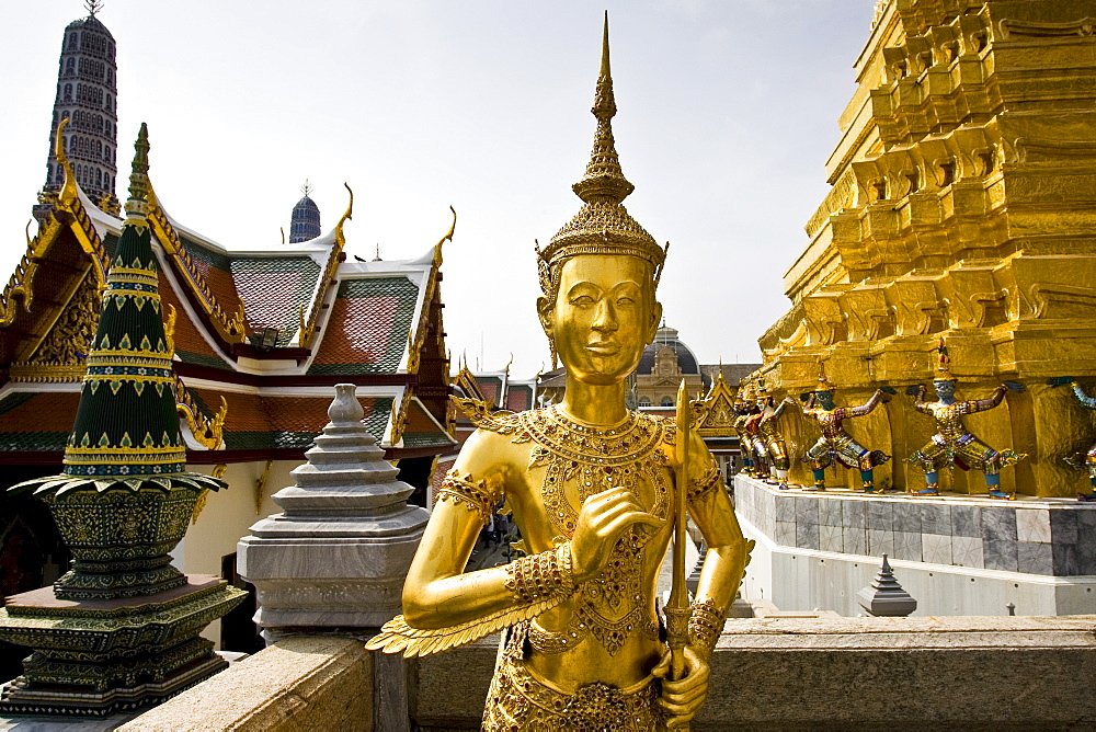 Gilt statue inside The Grand Palace and Temple complex, Bangkok, Thailand