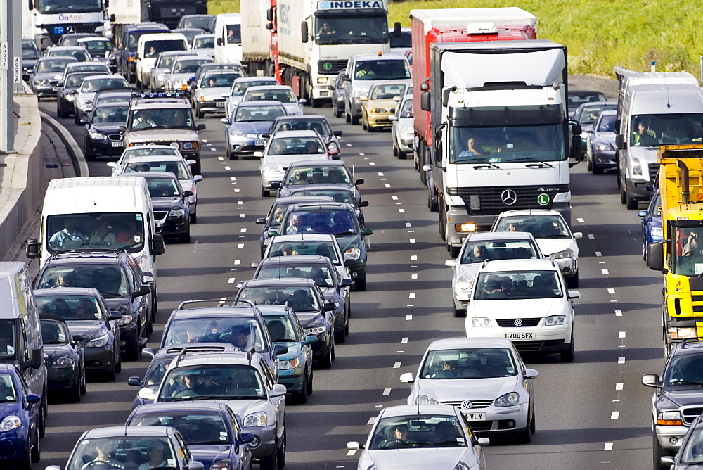 Traffic congestion cars and trucks on M25 motorway, London, United Kingdom