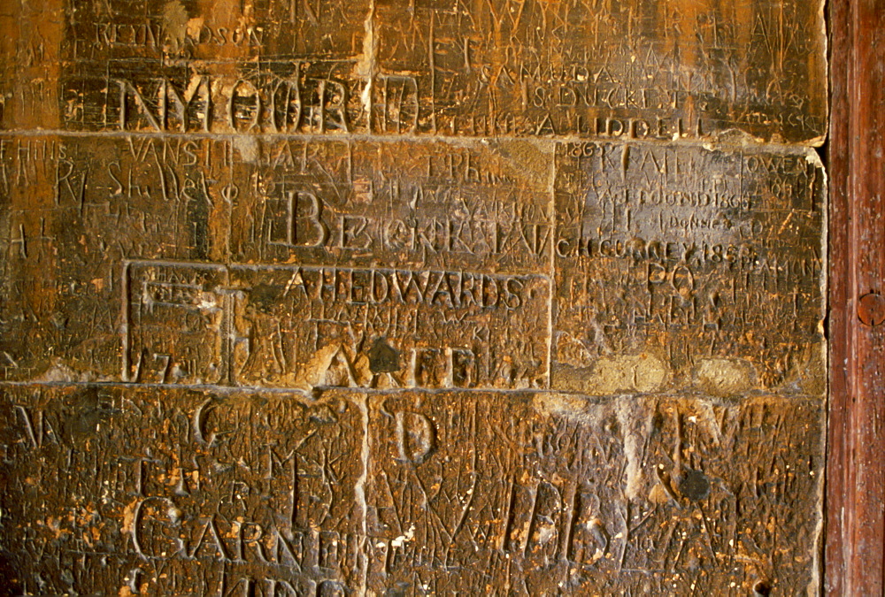 Names carved into a wall at Eton College boarding school, UK.