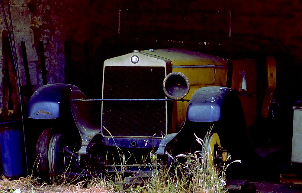 Vintage Fiat car awaiting restoration in a barn in Gloucestershire,England