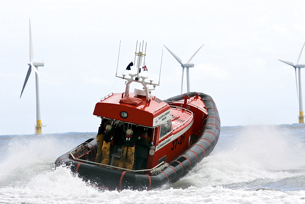 Caister lifeboat and wind turbines of the Caister Wind Farm, Norfolk, United Kingdom.