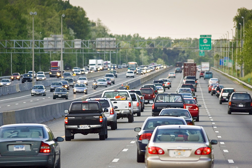 Heavy weight of traffic travelling on freeway lanes, outskirts of Washington DC, USA