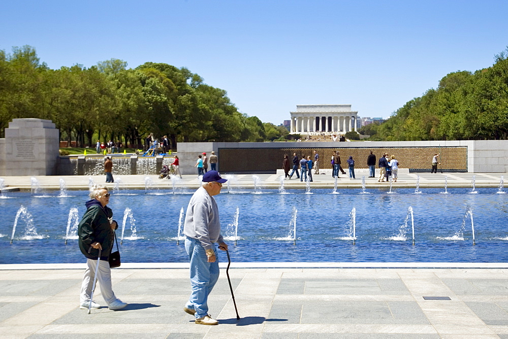 National World War II Memorial with Wall of Stars and Lincoln Memorial behind, Washington D.C, USA