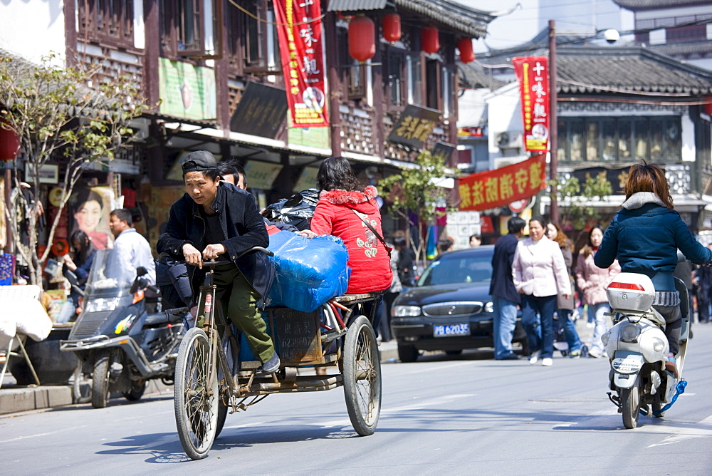 Tricycle on busy street in Old Shanghai, China