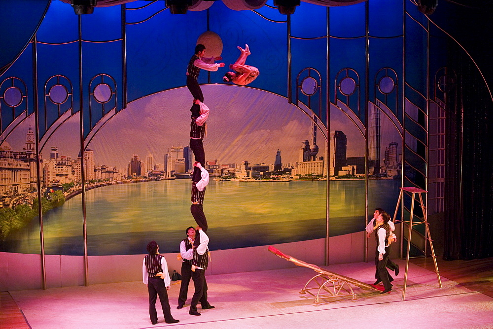 Members of the Shanghai Acrobatic Group performing on stage at the Shanghai Centre Theatre, China