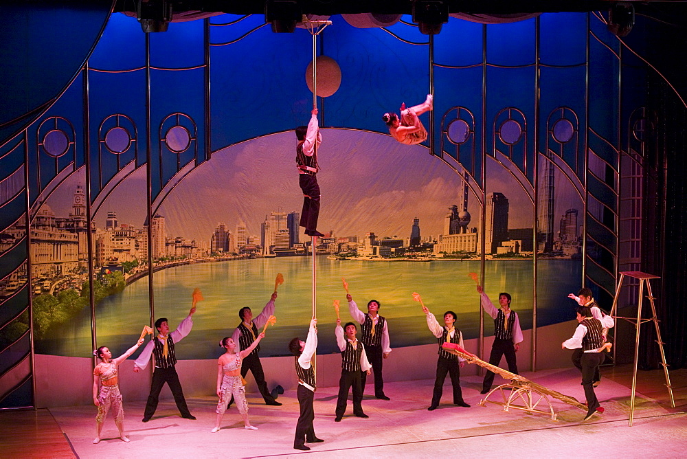 Members of the Shanghai Acrobatic Group performing on stage at the Shanghai Centre Theatre, China