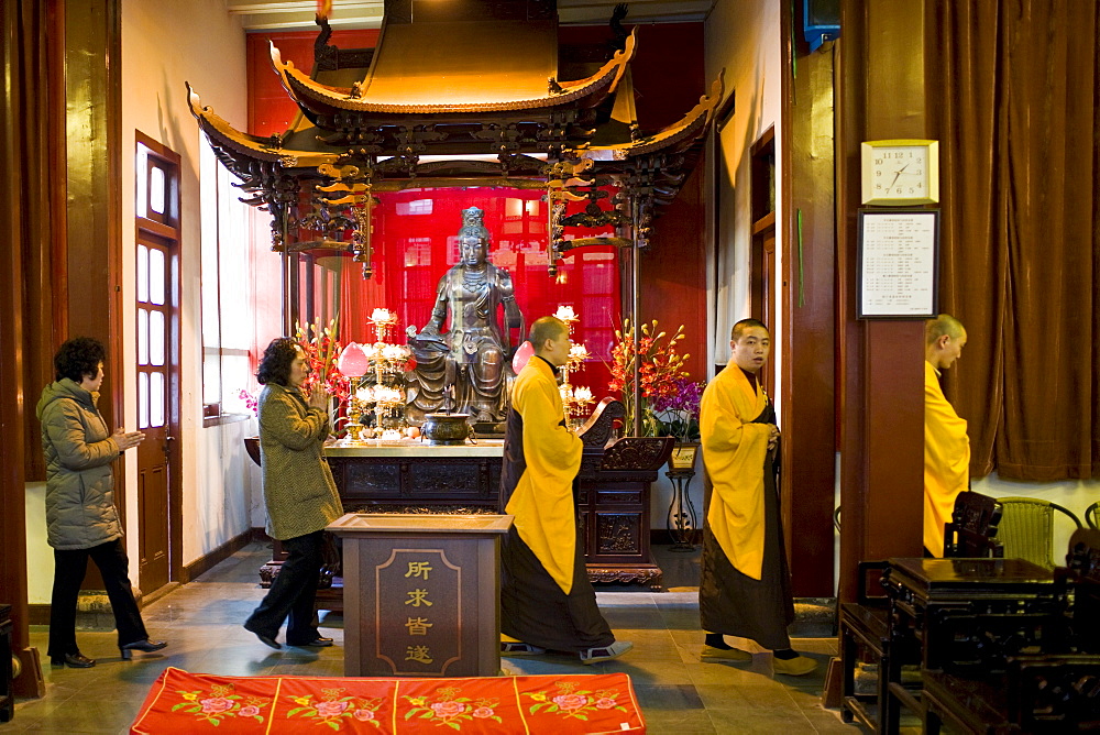 Buddhist monks and worshippers take part in funeral ceremony at the Jade Buddha Temple, Shanghai, China