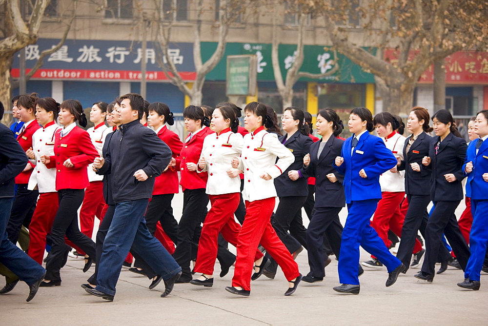 Staff on morning exercise in the grounds of the Shaanxi History Museum, Xian, China