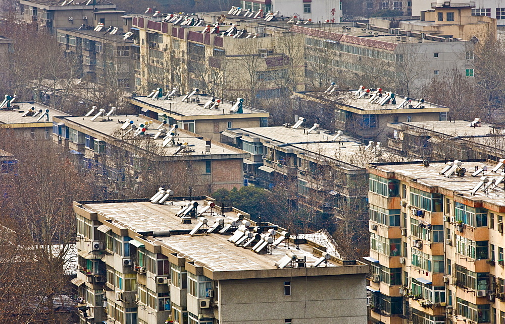 Solar panels on rooftops of apartment blocks in Xian seen from the Dayan Pagoda, China