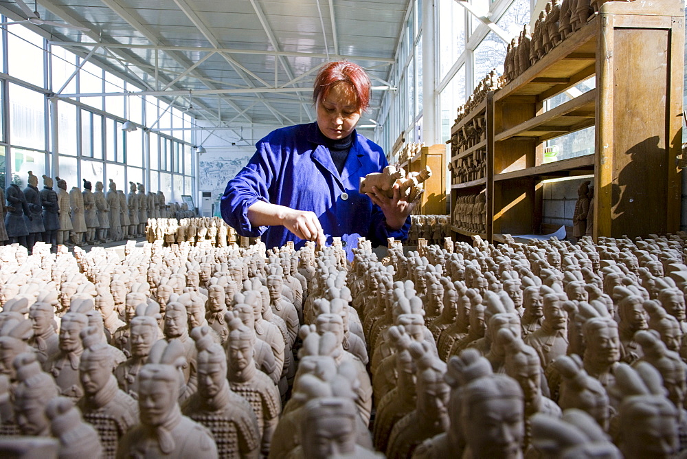 Terracotta Warrior souvenirs being made in factory, Xian, China