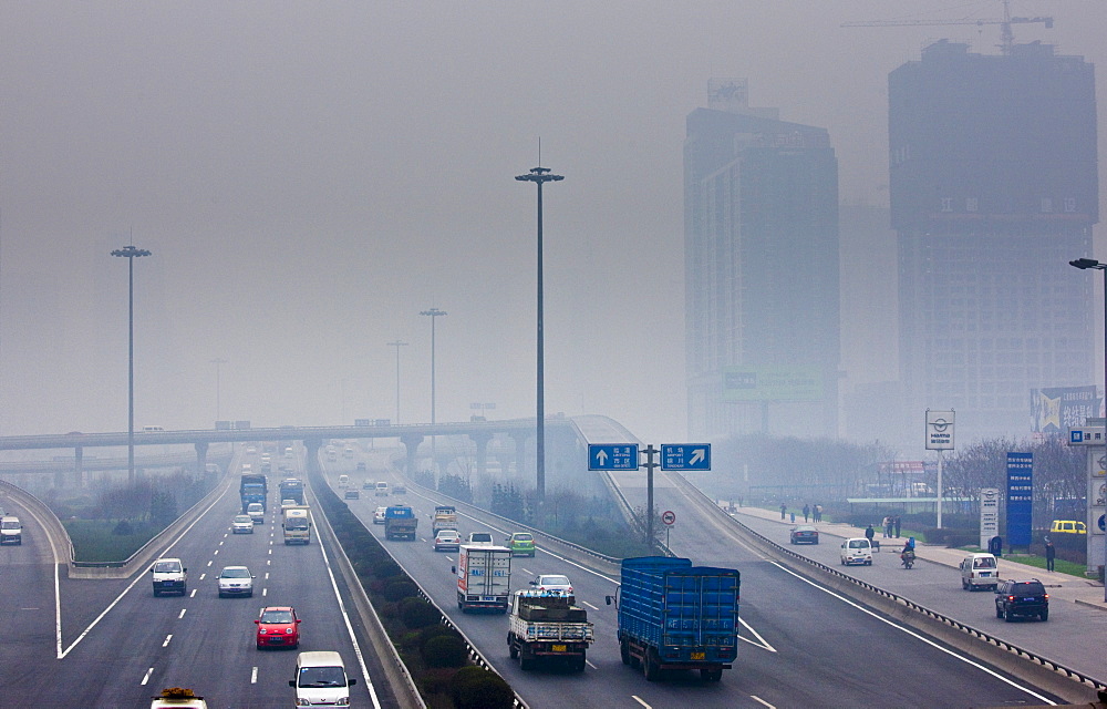 Traffic and pollution on motorway near the financial district of Xian, China