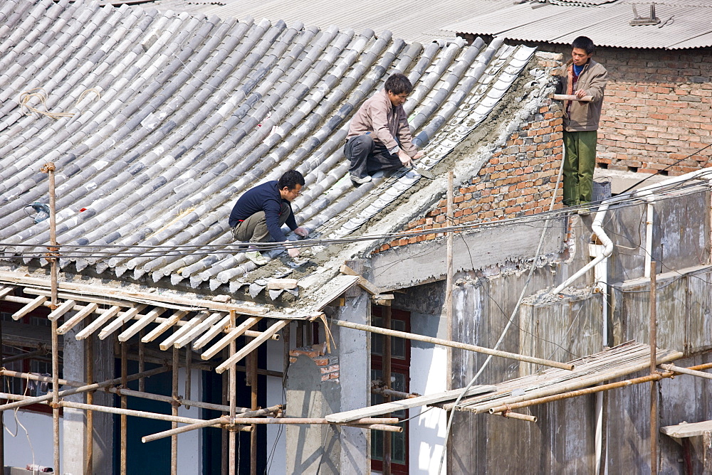 Builders and roofers viewed from The City Wall, Xian, China