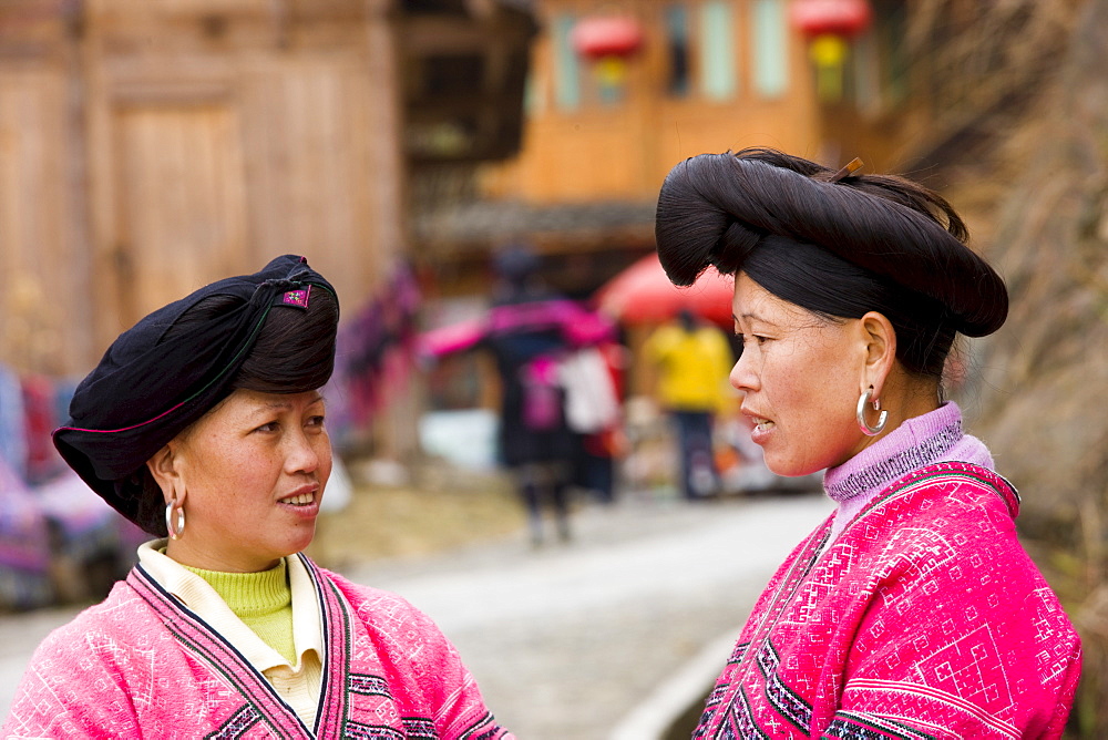 Women from Yao minority nationality with traditional long hair according to folk custom, Ping An, Guilin, China