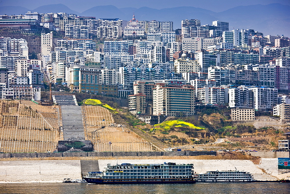 Victoria Line cruise ship by new town built to re-home communities as part of Three Gorges dam project, China