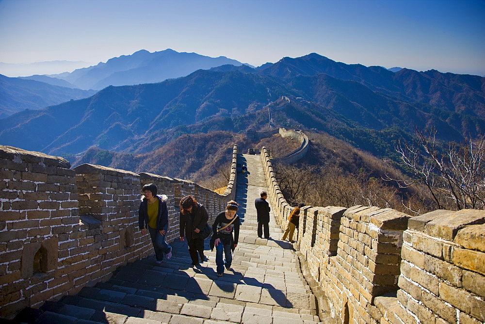 Tourists walk the ancient Great Wall of China at Mutianyu, north of Beijing (formerly Peking), China