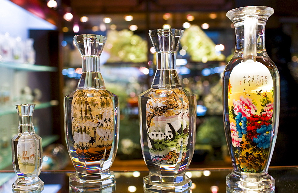 Glass bottles hand-painted on the inside displayed in Beijing Dragon Land jade gallery in Beijing, China