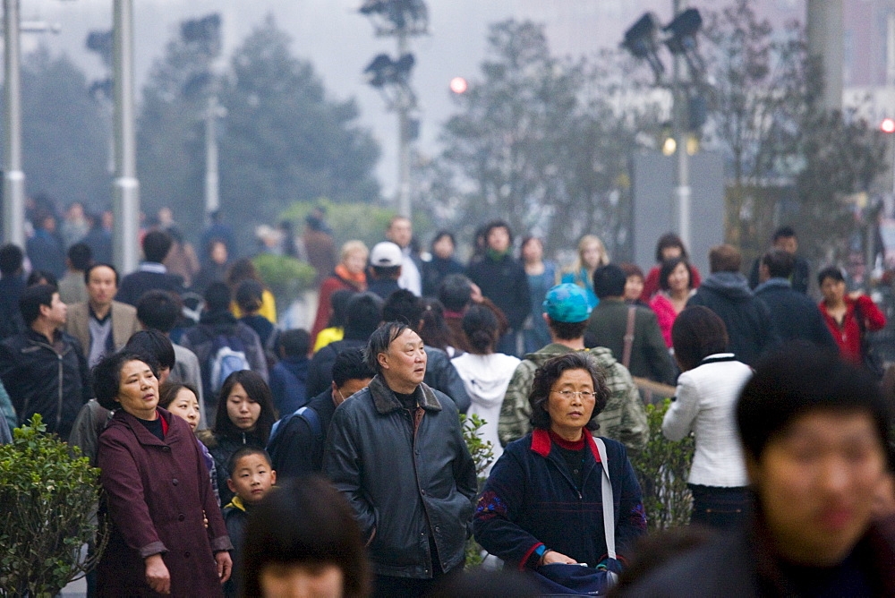 Crowded street corner of Chang An Avenue and Wangfujing Street in Beijing, China