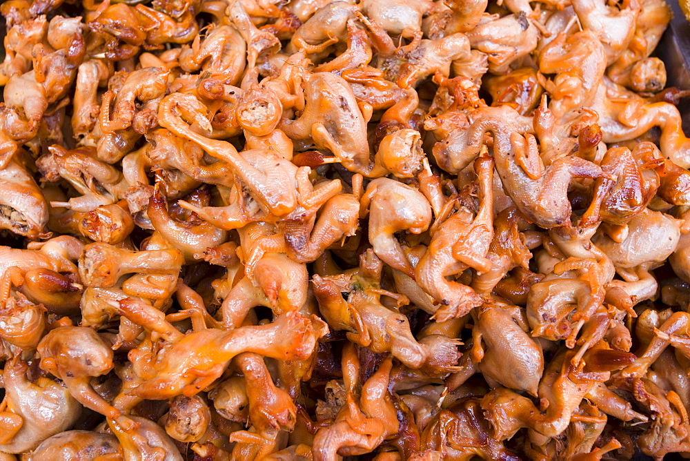 Deep fried sparrows for sale in the Yu Garden Bazaar Market, Shanghai, China