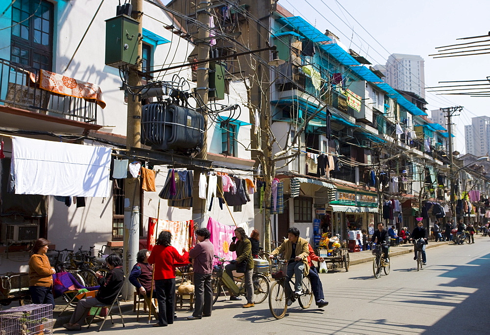 Busy street scene in Zi Zhong Road, old French Concession Quarter in Shanghai, China