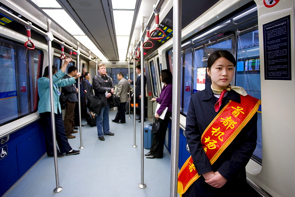 Hostess in shuttle train at Terminal Three of Beijing Capital International Airport, China