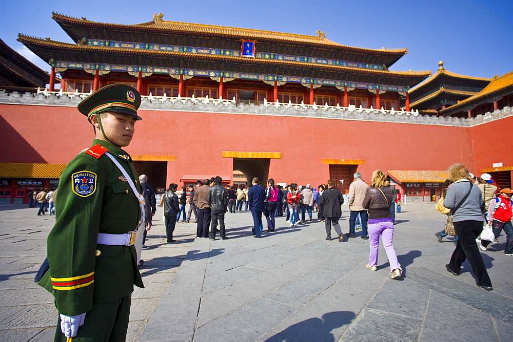 Soldier and tourists at the entrance to the Forbidden City, Beijing, China