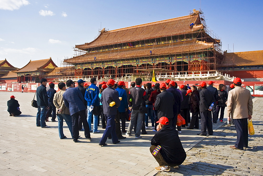 Tourists at Gate of Supreme Harmony which is undergoing renovation work, in the Forbidden City, Beijing, China