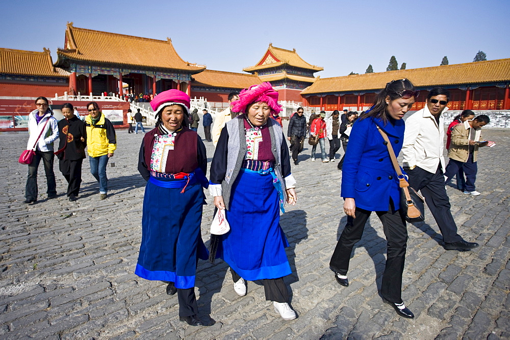 Women from Chinese minority group visit the Forbidden City, Beijing, China