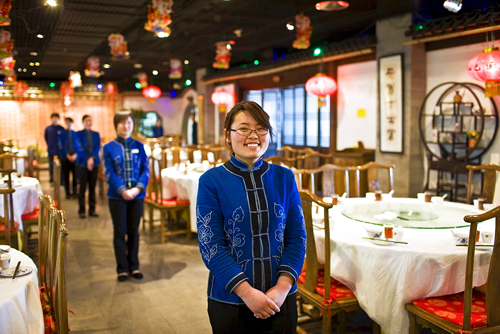 Waitresses in Chinese restaurant, Beijing, China